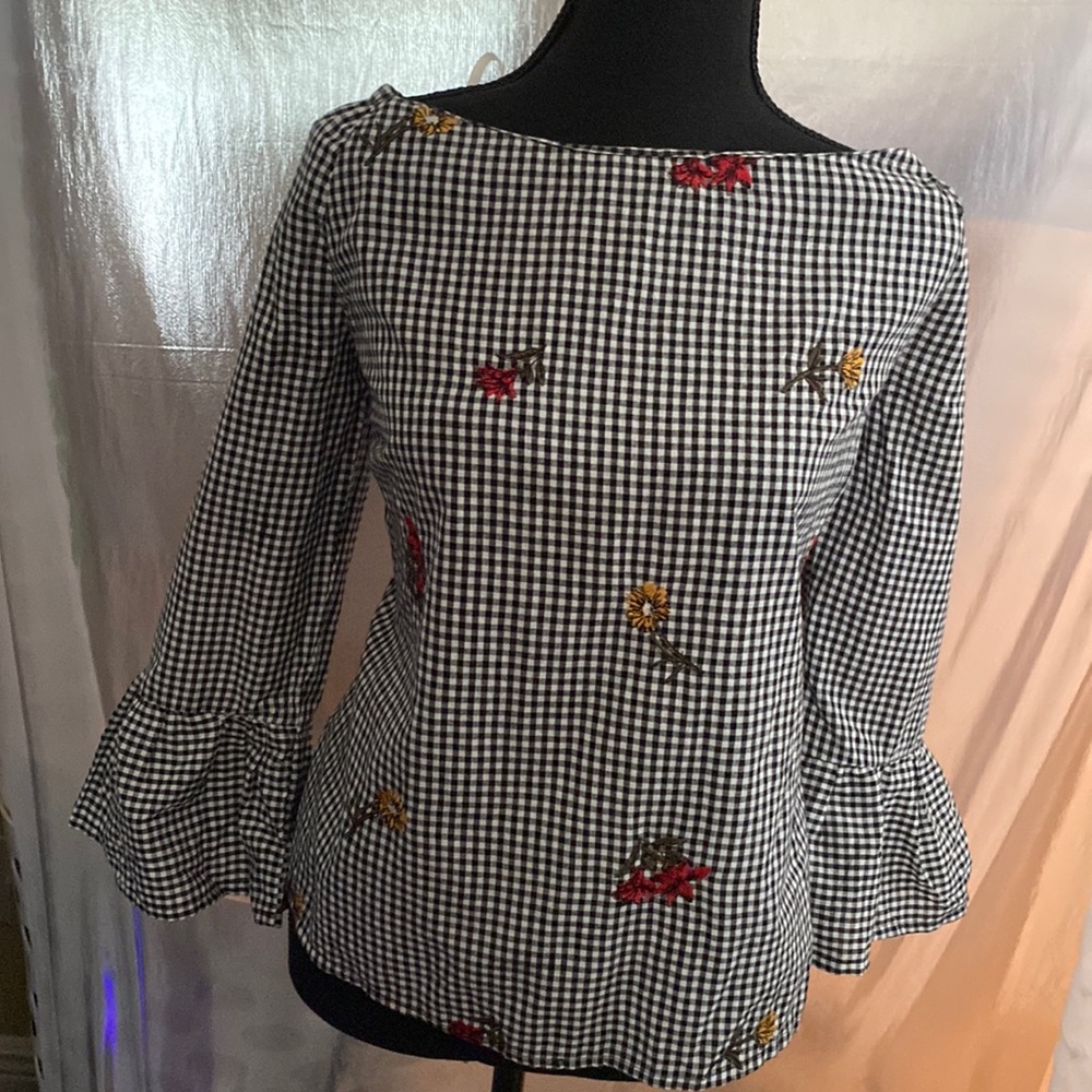 Black and white checkered long sleeve flare top